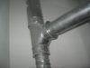 Natural draft water heater and induced draft motor equipped furnace vent pipes require Y shapped connectors - T is not permitted