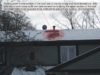 Snow melting on roof surface due to missing attic insulation