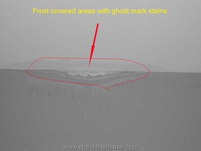 frost covered areas with ghost mark stains possibility of mold growth behind the wall