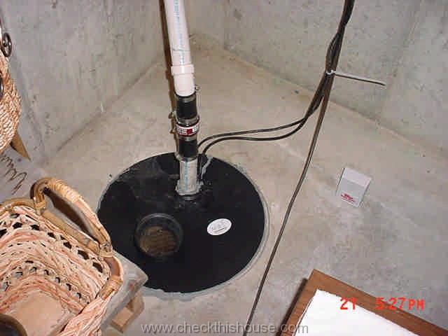 typical sump pump setup in the basement