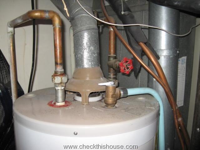https://checkthishouse.com/wp-content/uploads/typical-water-heater-vent-pipe-connection-but-with-missing-screws.jpg